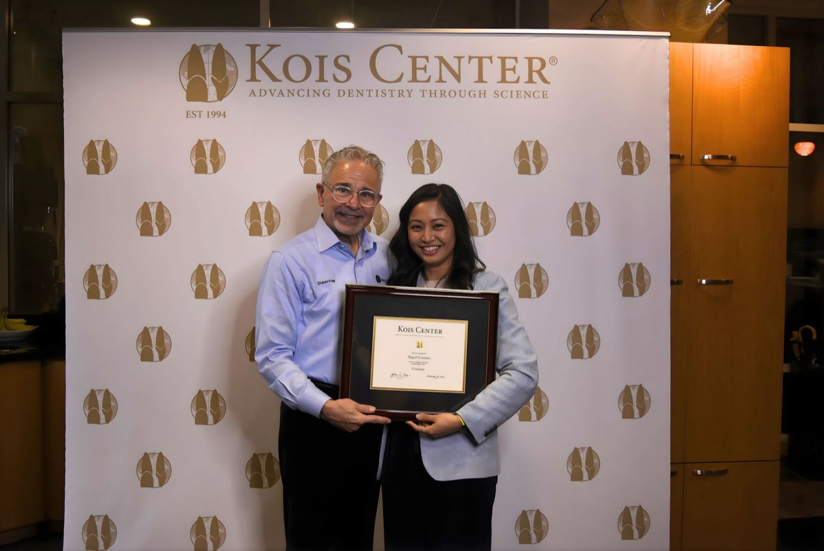 Dr. Abbey Gonzales receiving her Kois Center graduate certificate