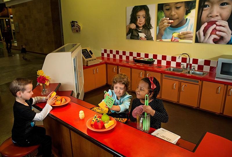 Children playing with hands-on exhibits at Discovery Place Kids museum in Huntersville, NC